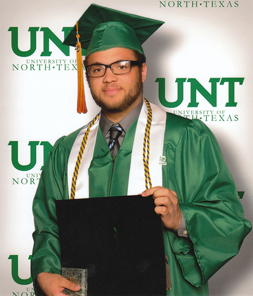 Jacob Montgomery Cole in green graduation cap and gown